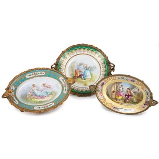 Three Sevres-style Gilt and Polychrome Plates with Ormolu Stands
