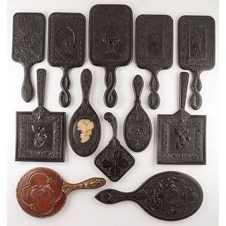 Twelve Thermoplastic Hand Mirrors with Figural and Floral Motifs