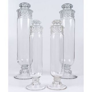 A Set of Four Pressed Glass Apothecary Display Jars