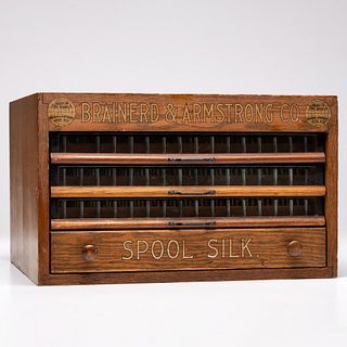 A Brainerd & Armstrong Co. Stenciled Tabletop Oak Spool Cabinet