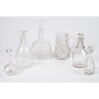 A Group of Blown and Cut Glass Decanters and Pitcher