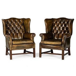 A Pair of Leather Upholstered Button Tufted Wingback Armchairs
