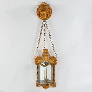 Monumental George II style giltwood lion sconce