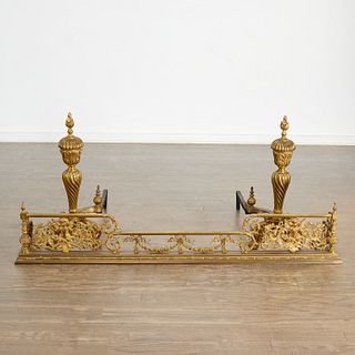 Louis XVI style bronze andirons and fire fender