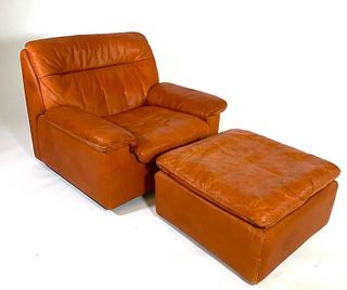 Leather Upholstered Armchair and Ottoman