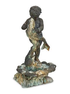 A Bronze Fountain of a Young Boy with Fish
Height 58 x width 30 x depth 30 inches.