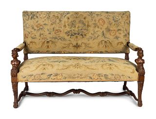 A Continental  Baroque Style Walnut Bench with  Needlepoint Upholstery
Height 43 x width 57 x depth 27 inches.