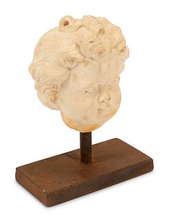 An Italian Carved Marble Head of a Youth
Height overall 10 1/2 x width of base 8 x depth 6 inches.