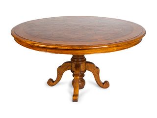 A Continental Parquetry Walnut Center Table
Height 32 1/2 x diameter 62 1/2 inches.