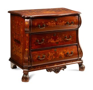 A Dutch Marquetry Inlaid Chest of Drawers
Height 33 1/2 x width 40 x depth 23 1/2 inches.