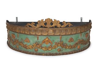 A Louis XVI Style Parcel Gilt, Painted and Carved Wood Bed Crown
Height 14 x width 38 x depth 19 1/2 inches.