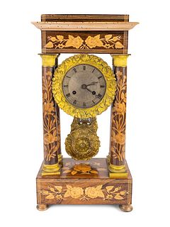 A French Marquetry Inlaid Portico Clock
Height 17 3/4 inches.