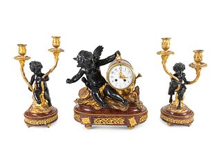 A Napoleon III Style Gilt Bronze Mounted Rouge Marble Clock Garniture
Clock, height 14 x width 14 x depth 8 inches.