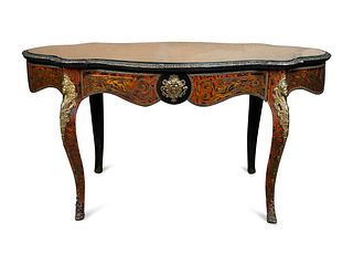 A Napoleon III Style Gilt Bronze Mounted Boulle Marquetry Table
Height 30 1/2 x width 59 x depth 34 1/2 inches.