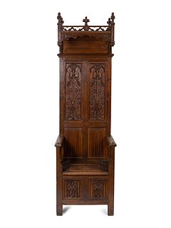A Jacobean Style Carved Oak Bishops' Chair
Height 90 x width 27 x depth 21 inches.