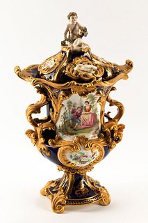 A Minton Porcelain Vase and Cover
Height 18 x width over handles 11 inches.