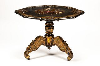 An English Mother-of-Pearl Inlaid Papier Mache Table
Height 29 1/2 x diameter of top 42 inches.