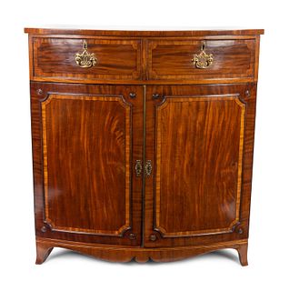 A George III Satinwood Inlaid Mahogany Bow Front Linen Press 50 1/2 x width 48 x depth 24 inches.
