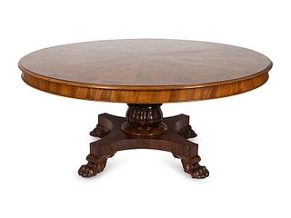 A Regency Crotch Mahogany Sunburst Inlaid Center Table Height 30 x diameter 66 inches.