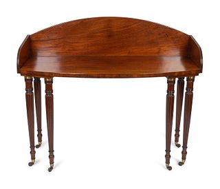 A Regency Mahogany Bow Front Dressing Table
Height 42 x width 49 x depth 20 3/4 inches.