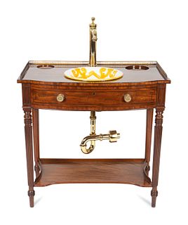 A Regency Style Mahogany Washstand with Brass Fixtures and Italian Ceramic Basin
Table, height 33 1/4 x width 33 1/4 x depth 19 1/2 inches.