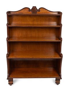 A George IV Carved Mahogany Waterfall Bookshelf In the Manner of Gillows Height 54 x width 36 x depth 15 3/4 inches.