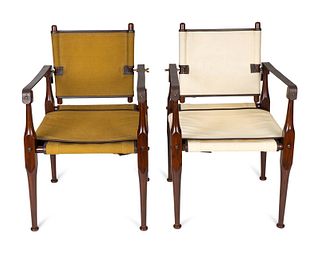 A Pair of British Colonial Style Mahogany, Canvas and Leather Strap Campaign Chairs
Height 36 x width 22 x depth 22 inches.