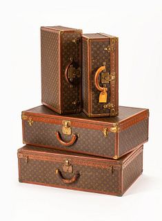 A Group of Four Louis Vuitton Hard-Sided Suitcases
Height of first suitcase 10 x width 31 1/2 x depth 20 1/2 inches.