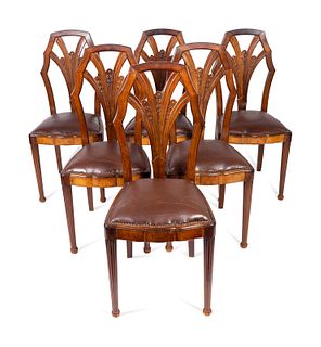 A Set of Six Art Deco Carved Walnut Dining Chairs
Height 41 x width 17 x depth 18 inches.