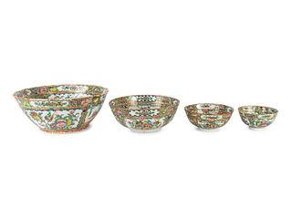 A Group of Four Chinese Famille Rose Porcelain Graduated Center Bowls
Height 5 x diameter 11 1/2 inches.