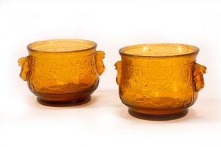 A Pair of Chinese Archaistic Yellow Glass Cache Pots
Height 5 x width 7 1/2 inches.