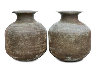 A Pair of Large Thai Hammered Metal Unrs
Height 43 x width 36 inches.