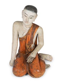 A Thai Polychromed Figure of a Seated Figure
Height 35 x width 17 x depth 23 inches.