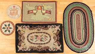 Four hooked rugs and a braided mat, mid 20th c.