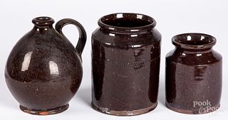 Two redware crocks and a jug, 19th c.