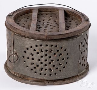 Unusual circular tin and walnut footwarmer