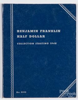 Twenty-nine Franklin silver half dollars.