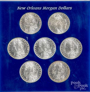 Seven New Orleans Morgan silver dollars