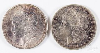 Two Morgan silver dollars; 1889 and 1891-O.