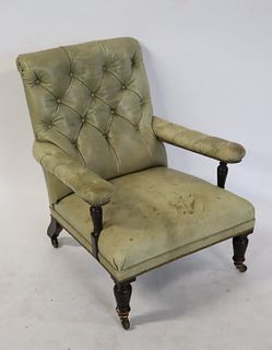 Antique Leather Upholstered Lounge Chair .