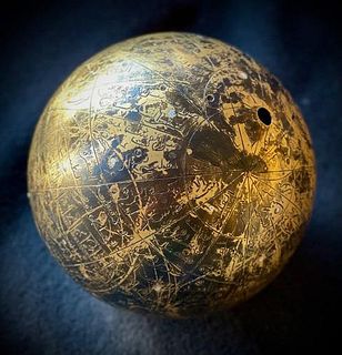 A brass astrological Islamic Globe with Silver inlayed pins.