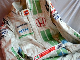An original race-worn suit as used during the 2007 season. Barichello was driving the Honda RA107, w