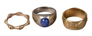 Three 14 Karat Gold Rings, one having blue star sapphire, 26.5 grams total weight.