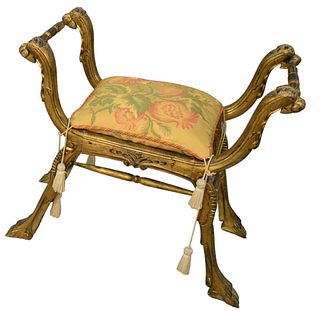 Italian Carved Bench with Animal Heads, custom cushion, height 25 1/2 inches, width 28 1/2 inches.
