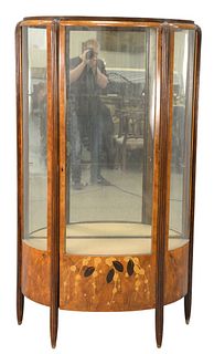 French Art Deco Vitrine, in the manor of Ruhlmann, having various inlays, height 68 inches, width 48 inches, depth 16 inches.