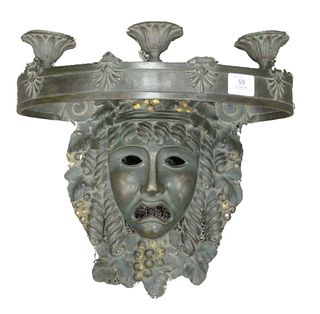 Bronze Three Light Sconce, having mask wall bracket with gilt berries and circular band with candle holders, height 14 inches, width 14 1/2 inches.