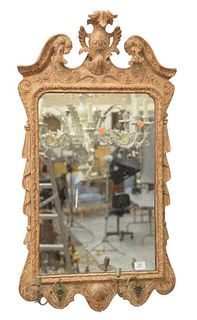English Girandole Mirror, in Chippendale taste, having two brass candle arm holders, 18th century, height 42 inches, width 23 inches.