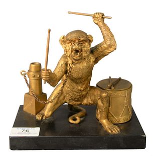 An Alexandre Leonard Desk Set, having a gilt bronze monkey with a drum form inkwell holding drum sticks and chained to a post form pen holder, height 