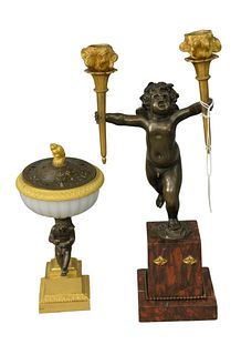 Two Piece Lot, to include a bronze putti form candlestick with two gilt bronze holders in the form of torches; along with an incense burner raised on 