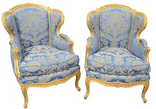 Pair of Louis XV Style Fauteuils, having gilt frame, custom upholstery, and down filled cushions, height 39 inches, width 29 inches.